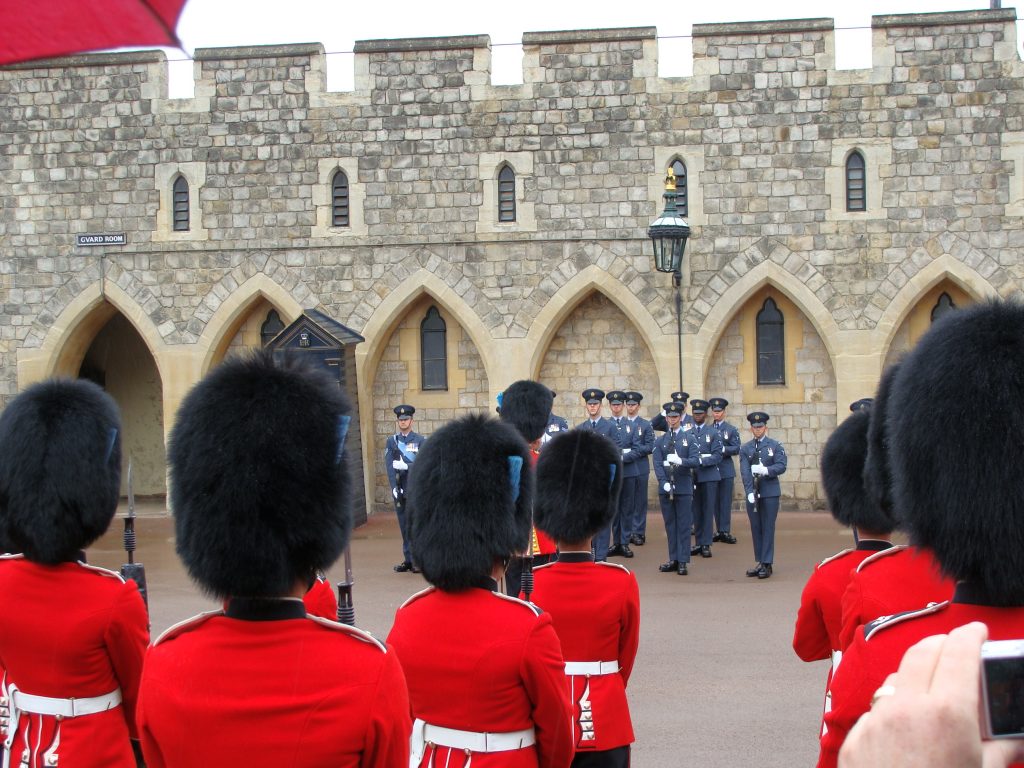 red jacket black hat guards England Windsor Castle